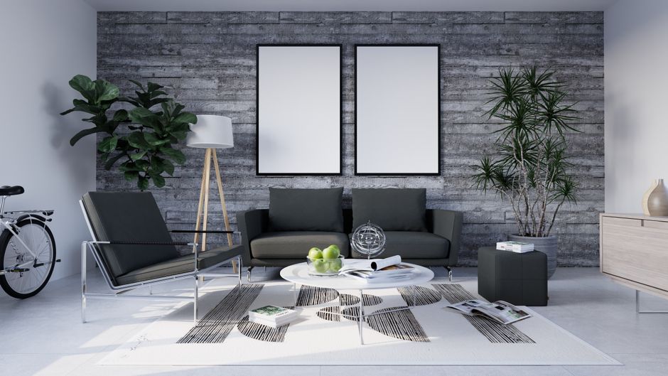 A neutral area rug anchoring a living room