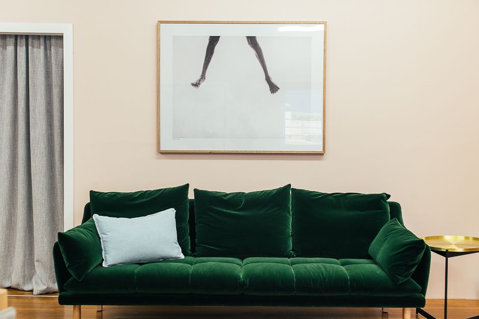 Framed wall art styled above a sofa