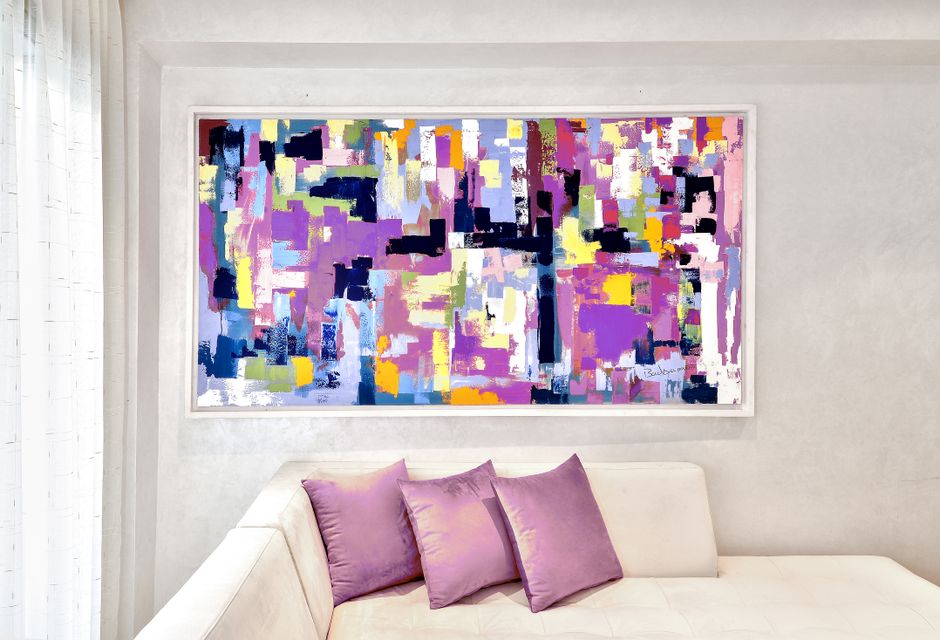 A large DIY abstract canvas on a living room wall