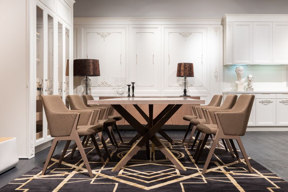 A dining rug sized so chairs stay on it