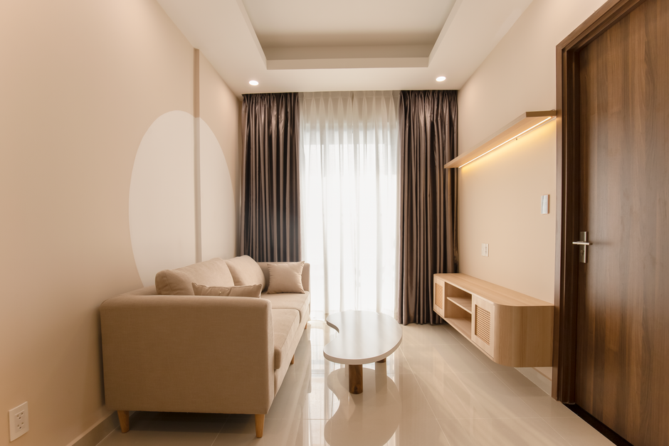 Bright, open small living room with light colors and minimal furniture