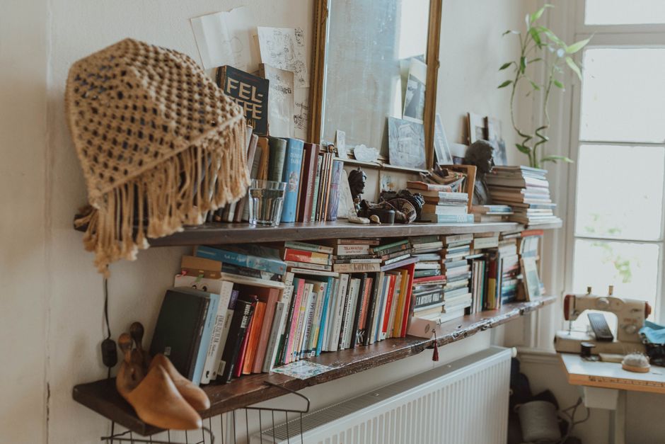 A styled bookshelf with books and decor