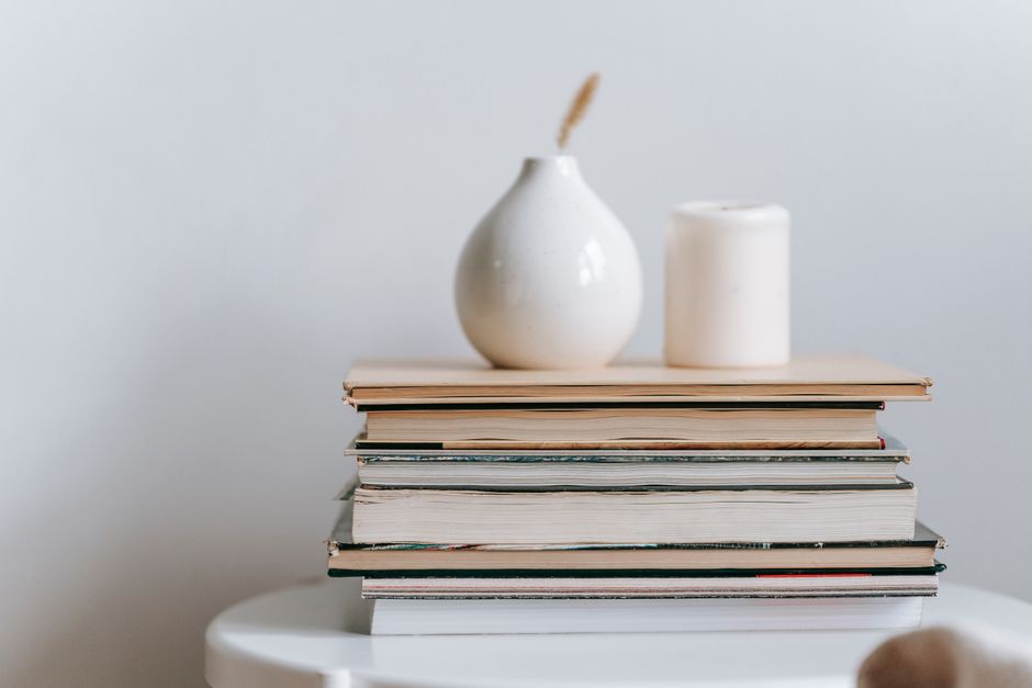 A mix of books, plants, and decorative objects