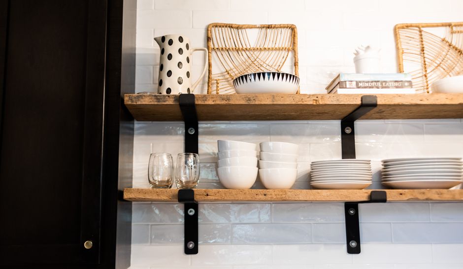 Styled open kitchen shelves with dishes and plants