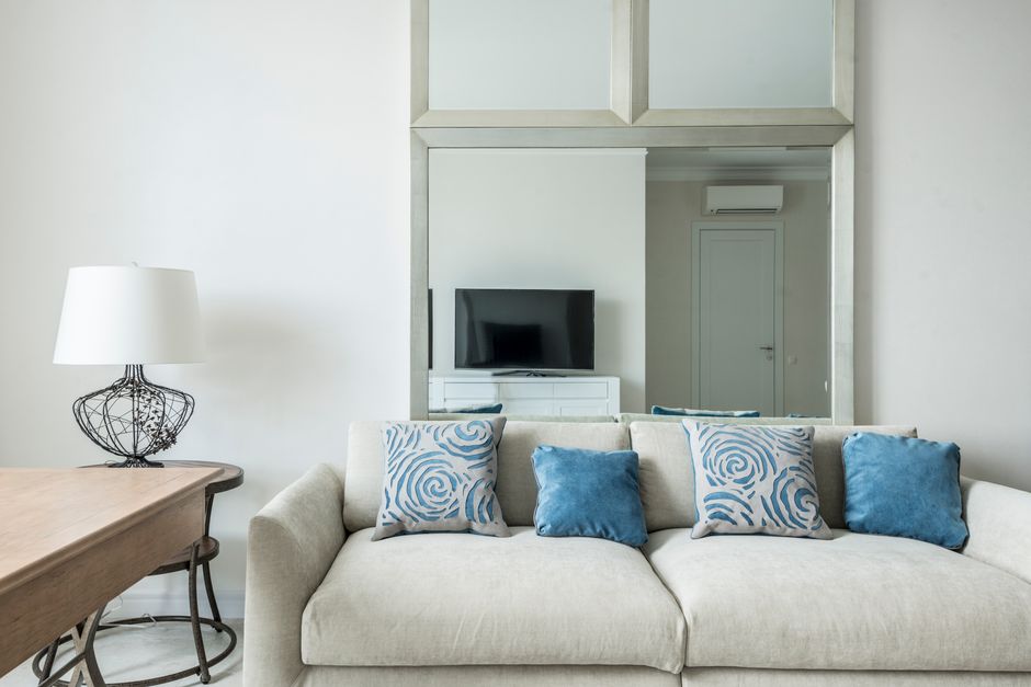 An elegant, expensive-looking living room in neutral tones
