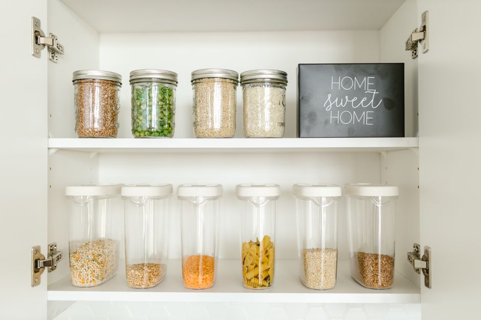 Clear labeled canisters holding dry goods