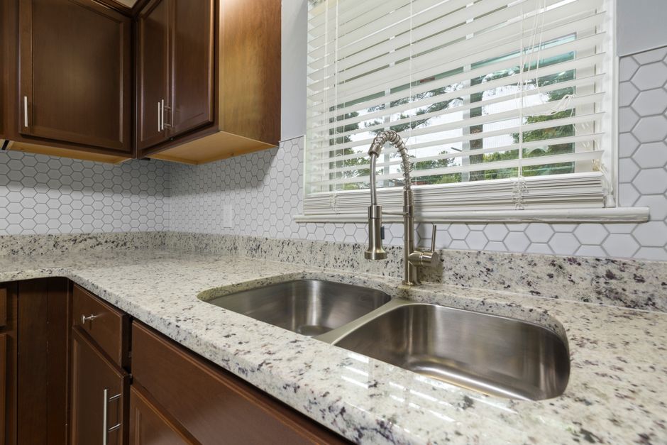 A kitchen with a fresh peel-and-stick tile backsplash