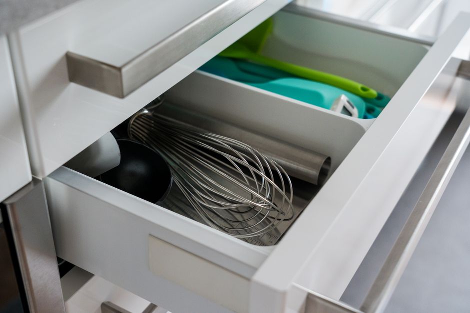 An organized kitchen drawer with dividers