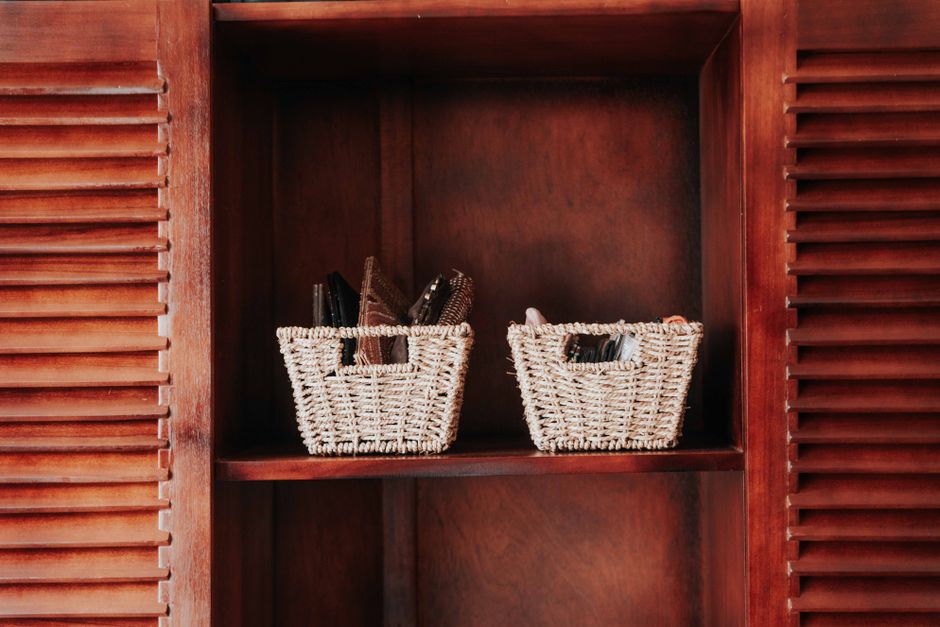 Neatly organized storage baskets on a shelf
