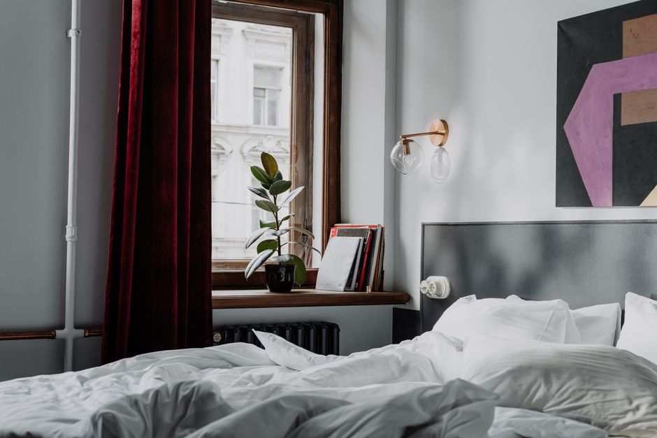 Flowing linen curtains framing a bright window with soft natural light