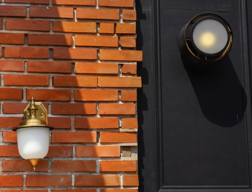 pendant light fixture combining brass and matte black finishes