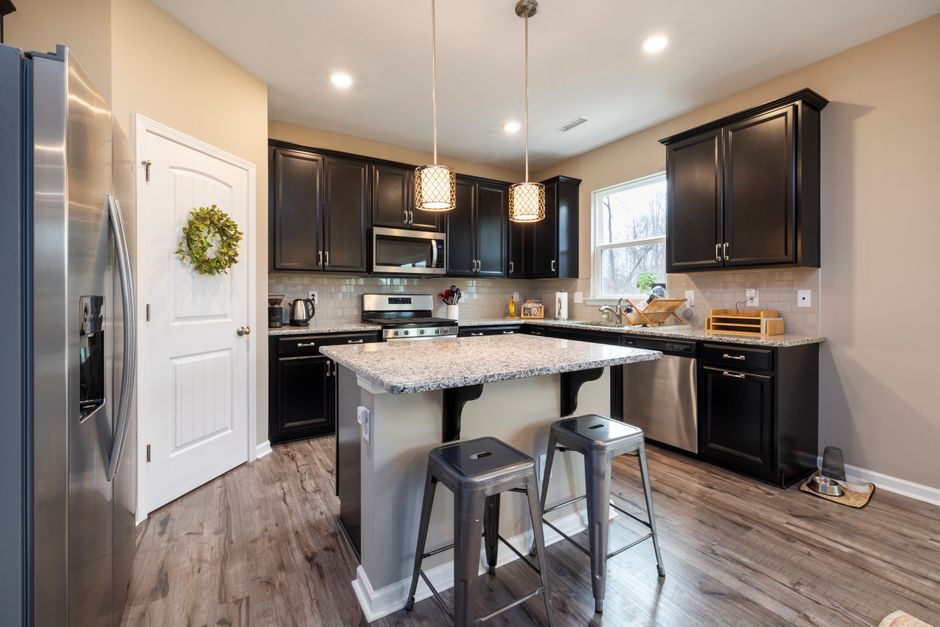 Narrow kitchen island with open shelving underneath