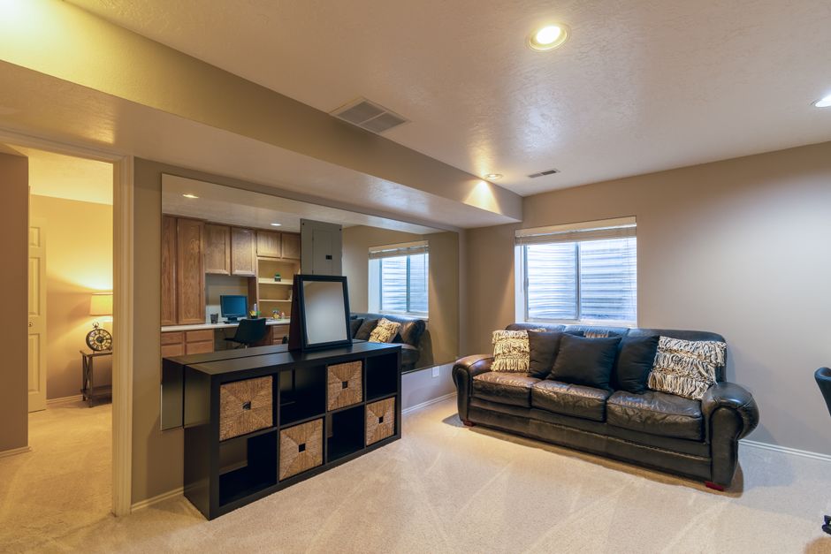 Basement room with layered lamp and accent lighting