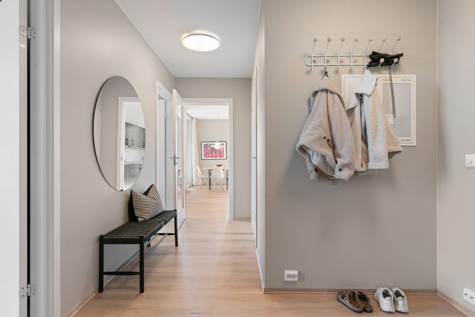 low hooks and labeled bins for kids in an entryway